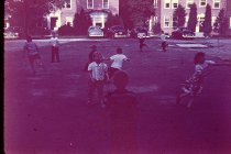 children on playground, Swift Hall in background